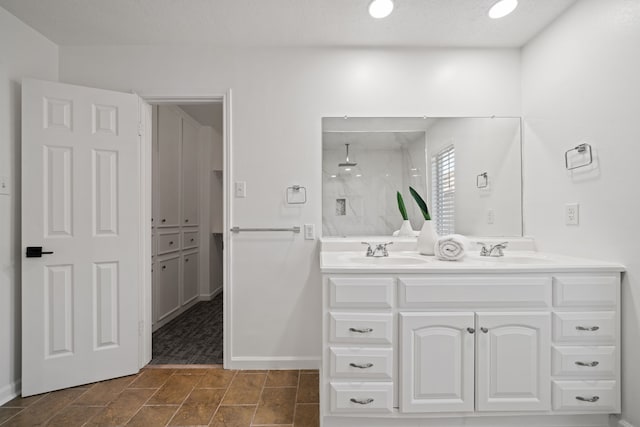 bathroom with a shower and vanity