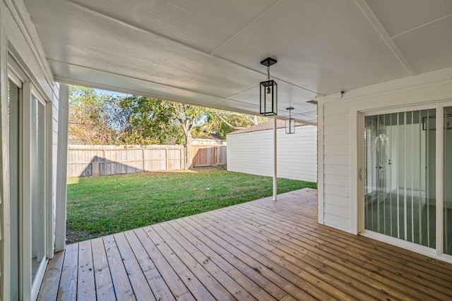 wooden terrace with a yard