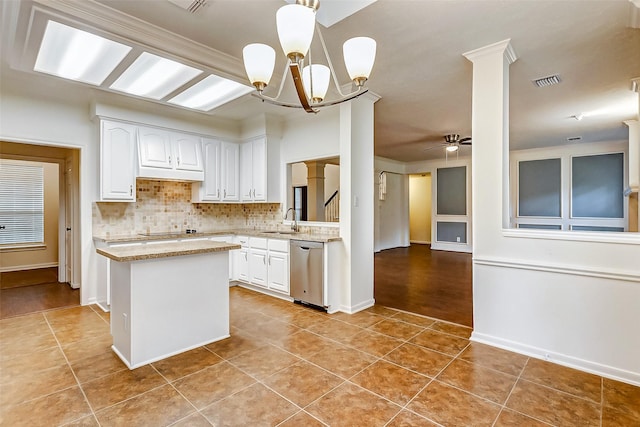 kitchen with dishwasher, light tile patterned floors, white cabinets, sink, and ceiling fan with notable chandelier