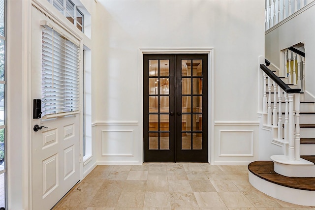 foyer entrance featuring french doors