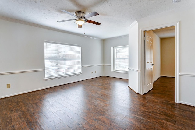 empty room featuring crown molding, a textured ceiling, dark hardwood / wood-style floors, and ceiling fan