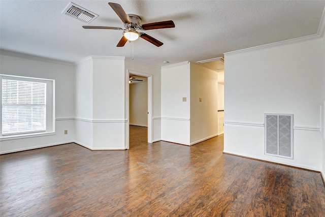 empty room with ceiling fan, crown molding, and dark hardwood / wood-style floors