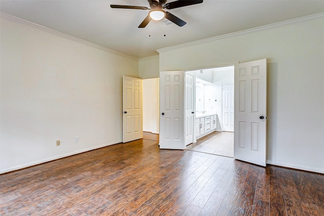 unfurnished bedroom featuring dark wood-type flooring, ceiling fan, and ornamental molding