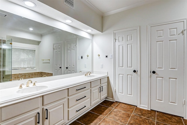 bathroom with vanity, crown molding, and tile patterned floors