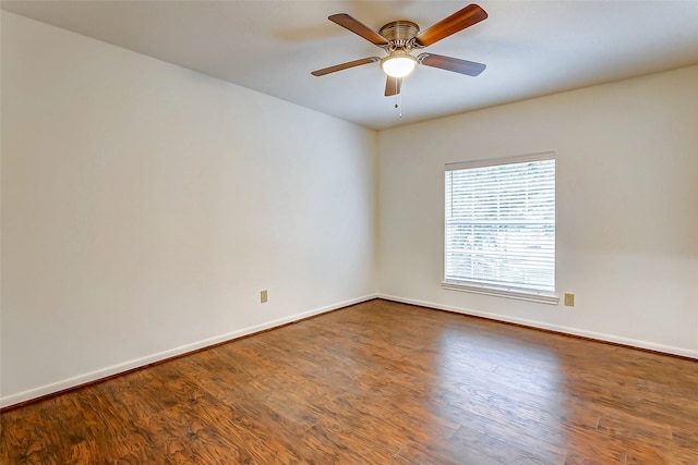 empty room featuring hardwood / wood-style floors and ceiling fan