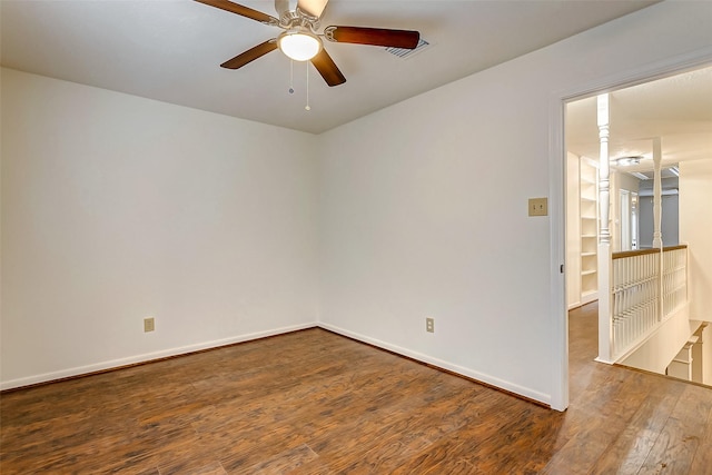 unfurnished room with ceiling fan and hardwood / wood-style floors