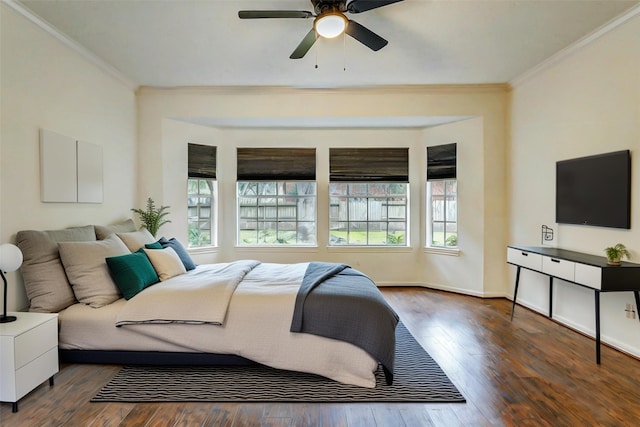 bedroom featuring ceiling fan, dark hardwood / wood-style flooring, and ornamental molding