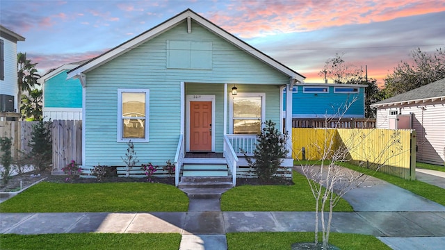 bungalow-style house with a yard