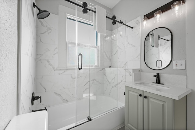 bathroom featuring vanity and bath / shower combo with glass door