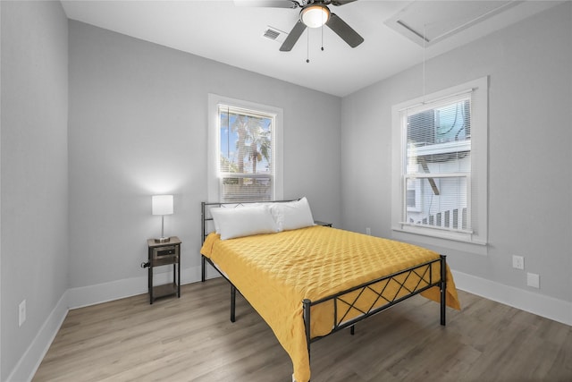 bedroom featuring ceiling fan and light hardwood / wood-style flooring