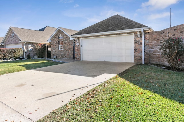 view of front facade with a front yard and a garage