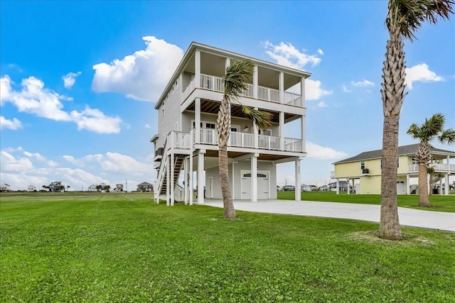 rear view of house with a yard, a garage, and a carport