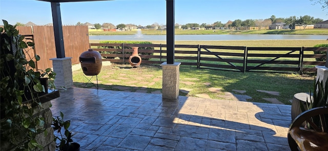 view of patio featuring a water view