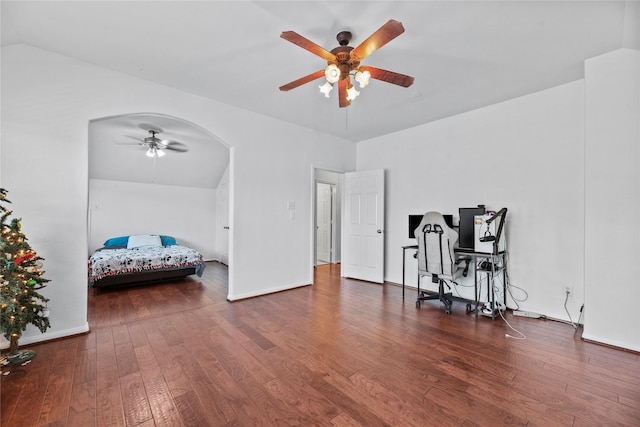 office area with lofted ceiling, dark wood-type flooring, and ceiling fan