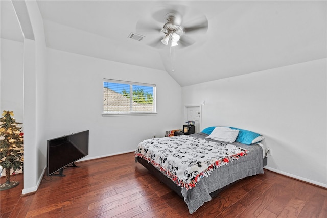 bedroom with vaulted ceiling, ceiling fan, and dark hardwood / wood-style flooring