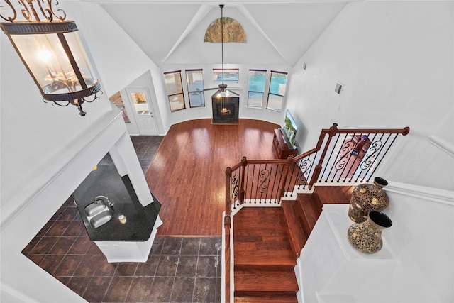 stairway featuring vaulted ceiling