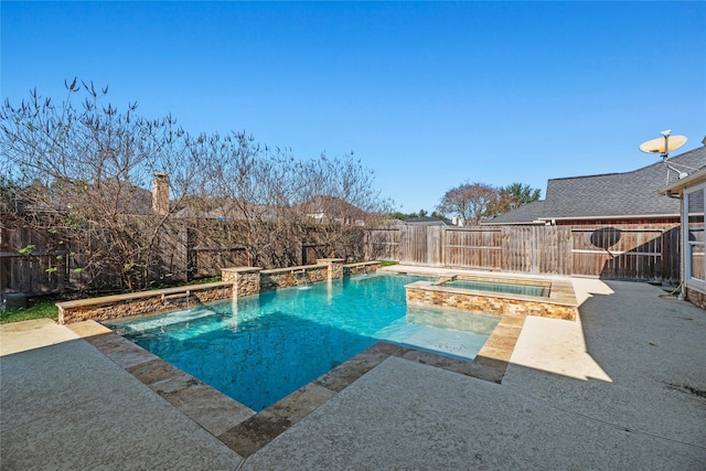 view of pool with an in ground hot tub, pool water feature, and a patio area