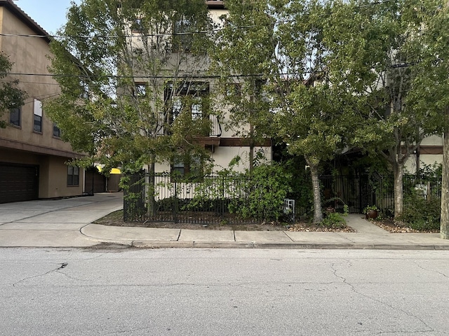 3932 Feagan St, Houston, TX 77007 - view of property hidden behind natural elements featuring stucco siding