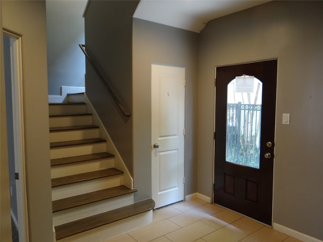 3932 Feagan St, Houston, TX 77007 - entrance foyer featuring stairway, light tile patterned floors, and baseboards