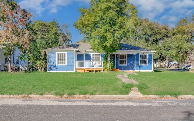 single story home featuring a front yard