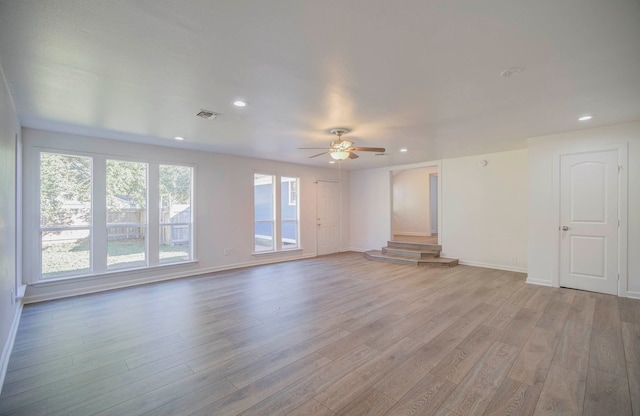 unfurnished living room with light hardwood / wood-style floors and ceiling fan