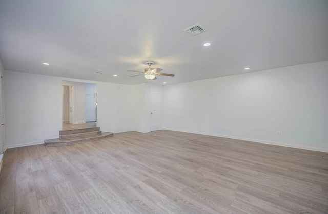 unfurnished room with light wood-type flooring and ceiling fan