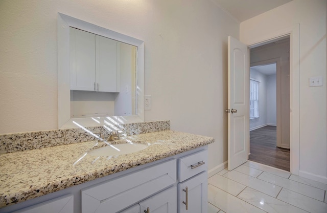 bathroom with hardwood / wood-style flooring and vanity