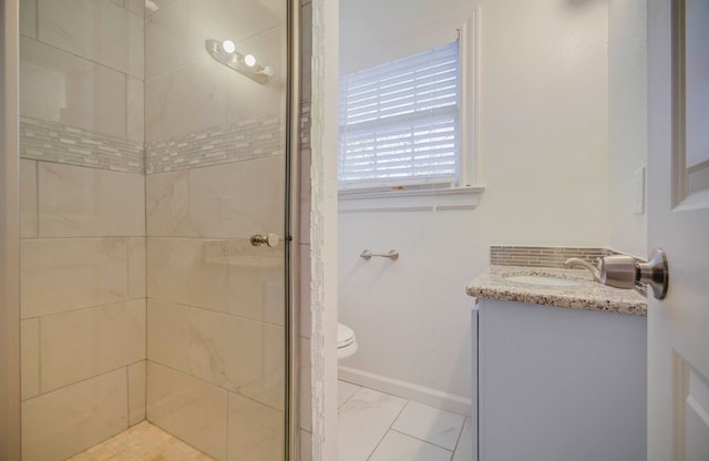 bathroom featuring vanity, toilet, and walk in shower