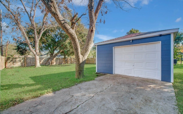 garage with a lawn