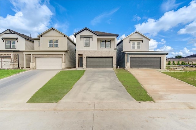 view of front of home with stone siding, an attached garage, and driveway