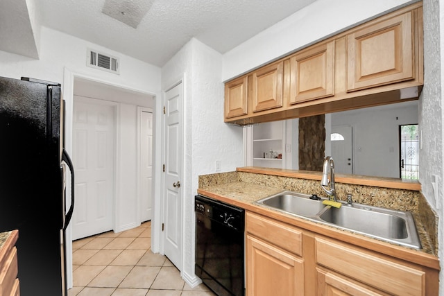 kitchen featuring sink, light brown cabinets, a textured ceiling, light tile patterned floors, and black appliances