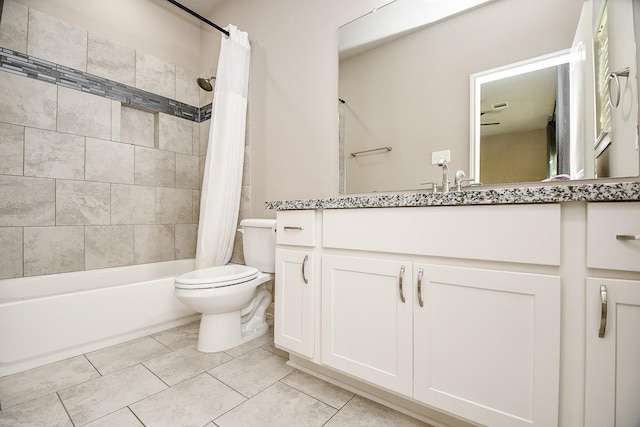 full bathroom featuring shower / tub combo, vanity, toilet, and tile patterned floors