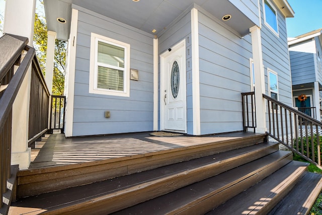 view of exterior entry featuring a porch