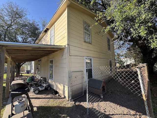 view of property exterior with a carport