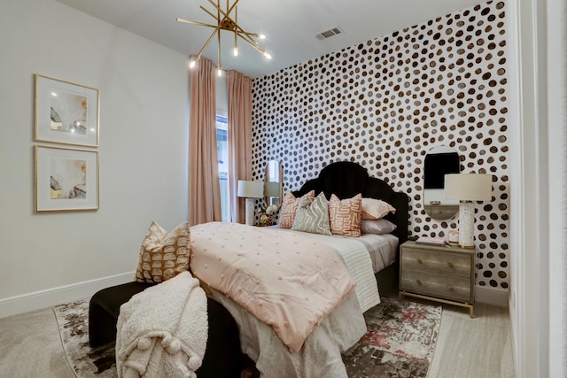 bedroom with a notable chandelier