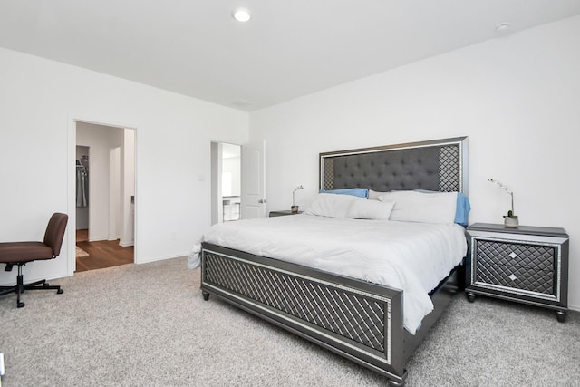 bedroom featuring carpet floors and a spacious closet