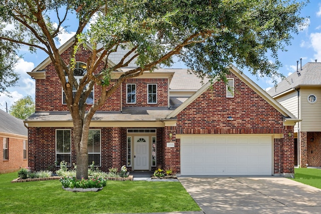 view of front facade with a garage and a front yard