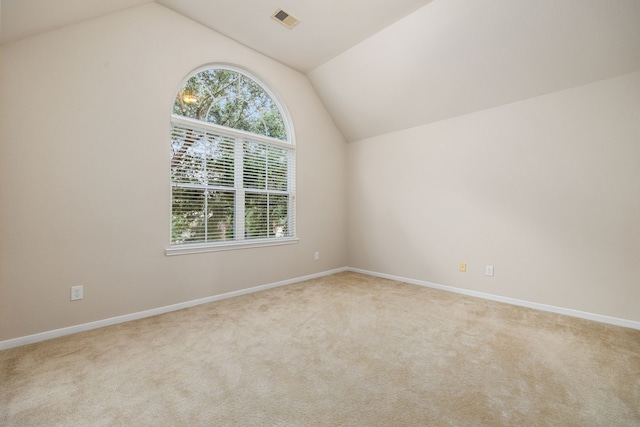 bonus room featuring light carpet and lofted ceiling