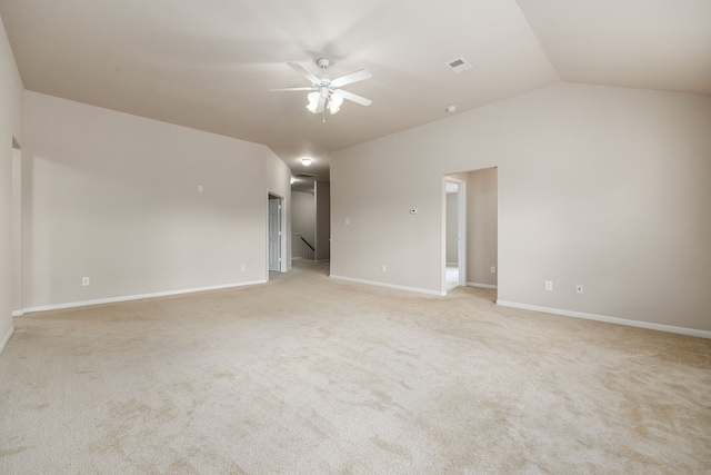 carpeted spare room with ceiling fan and lofted ceiling