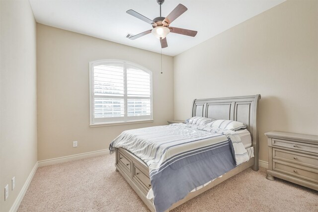 bedroom featuring light carpet and ceiling fan