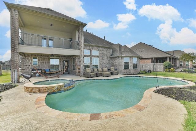 view of swimming pool with an in ground hot tub, a patio, and an outdoor hangout area