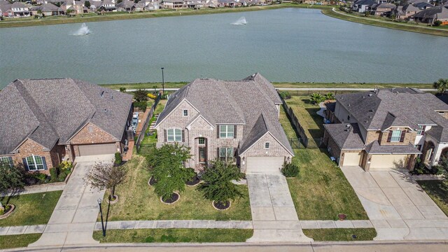 drone / aerial view with a water view