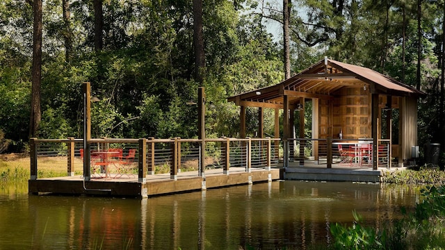 view of property's community featuring a water view and a gazebo