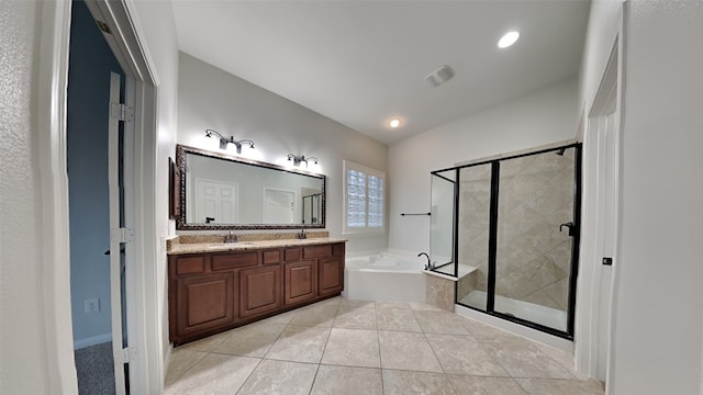 bathroom with tile patterned floors, vanity, and plus walk in shower