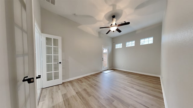 spare room featuring ceiling fan and light wood-type flooring