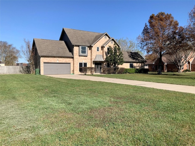 view of front of home with a garage and a front lawn