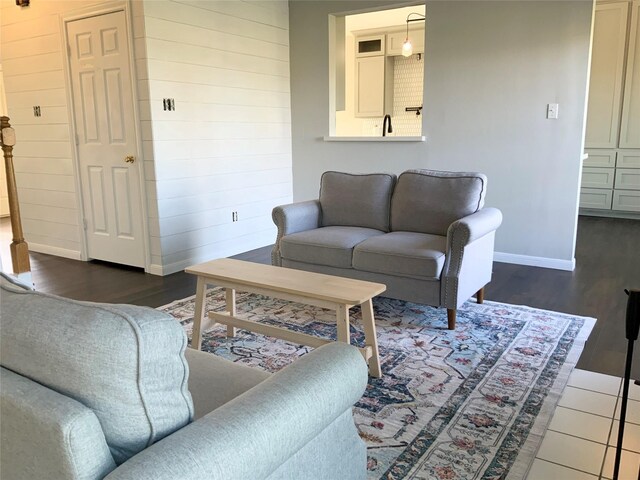 living room with dark hardwood / wood-style flooring