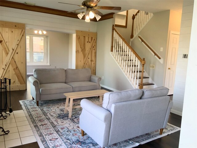 living room featuring ceiling fan and hardwood / wood-style floors