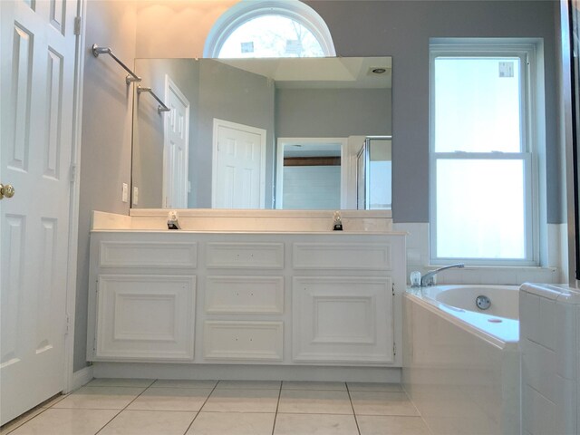 bathroom featuring tile patterned flooring, vanity, and independent shower and bath