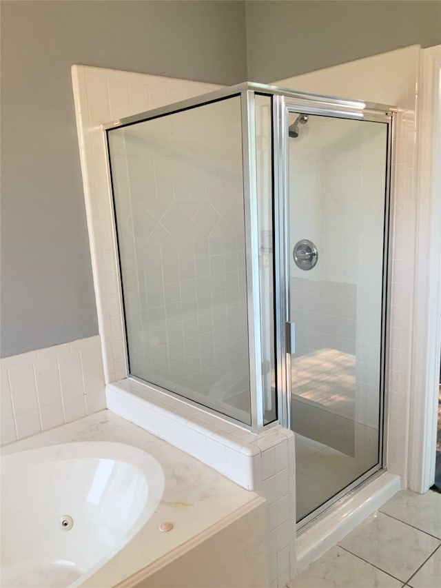 bathroom with shower with separate bathtub